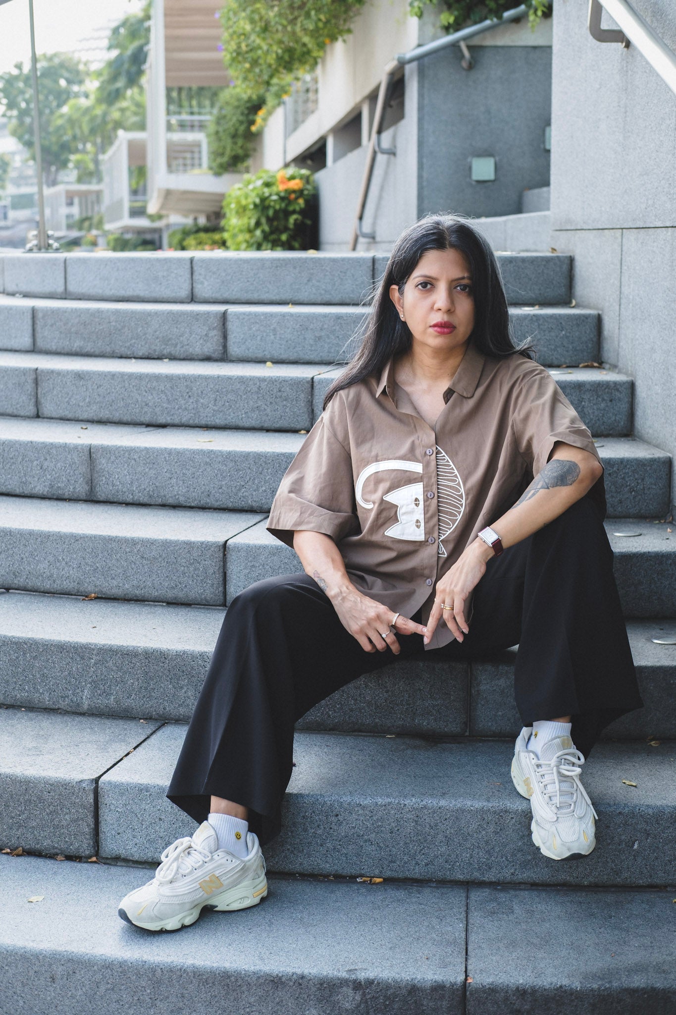 women's brown Japanese styled box shirt with half sleeves paired with black pants. 